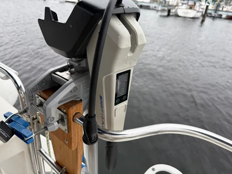 Slide: The Image of Electric motor mounted on a 2000 Catalina 36 MkII sailboat, docked by the water. - 18