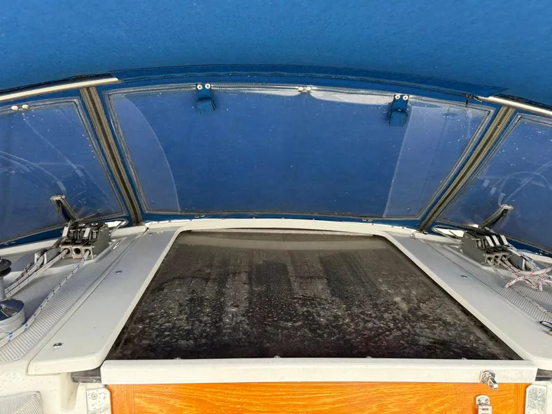 Slide: The Image of Cockpit view of a 2000 Catalina 36 MkII sailboat with blue canopy. - 19
