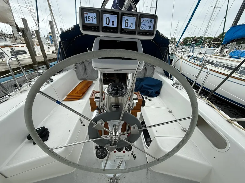 Slide: The Image of Cockpit of 2000 Catalina 36 MkII sailboat with steering wheel and navigation instruments. - 24