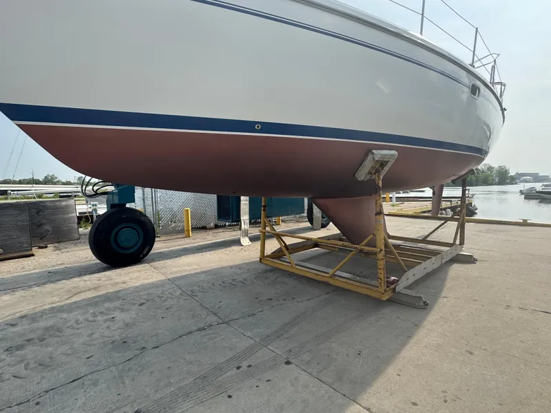 Slide: The Image of Catalina 36 MkII 2000 sailboat on dry dock, showcasing hull and keel. - 26