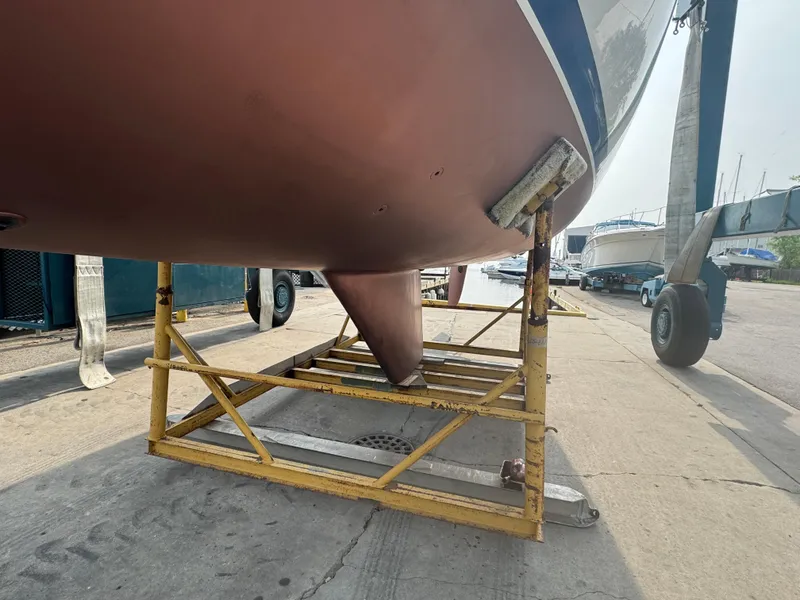 Slide: The Image of Catalina 36 MkII 2000 sailboat hull on a stand in a boatyard. - 27