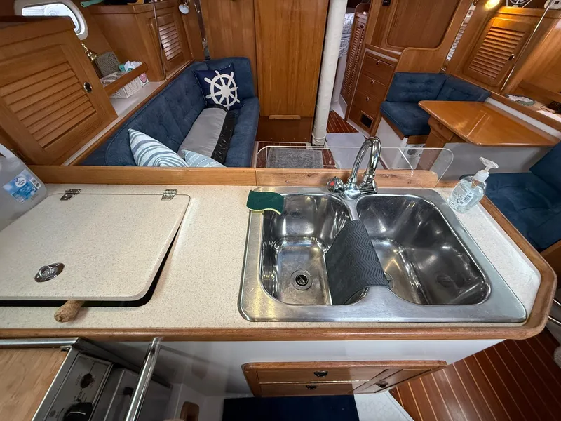 Slide: The Image of Interior of 2000 Catalina 36 MkII sailboat with kitchen sink and seating area. - 34