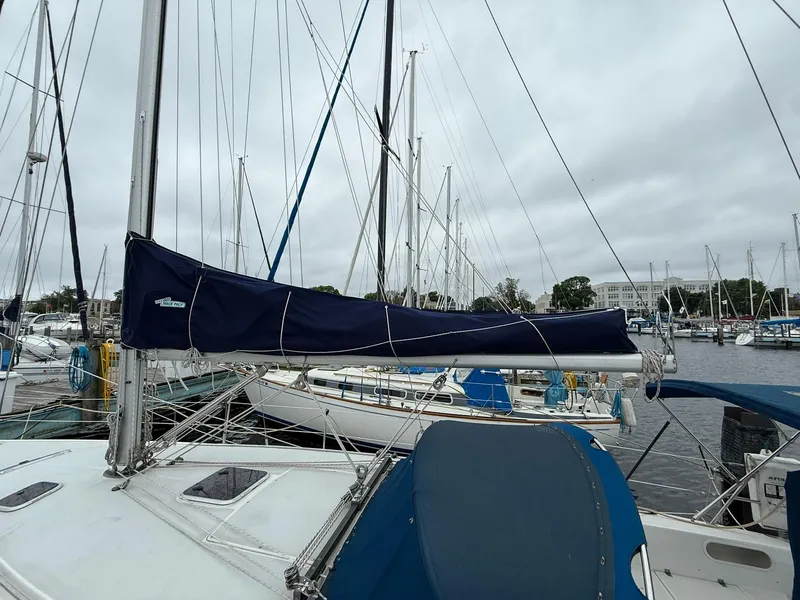 Slide: The Image of Catalina 36 MkII sailboat from 2000 docked at a marina on a cloudy day. - 4