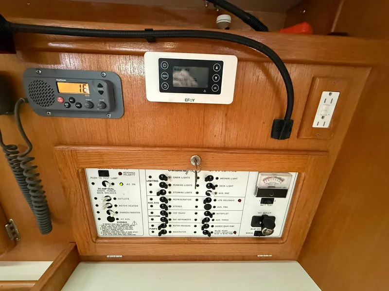 Slide: The Image of Control panel of a 2000 Catalina 36 MkII sailboat, featuring switches and outlets. - 40
