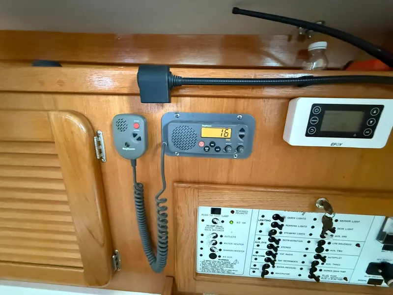Slide: The Image of Control panel of a 2000 Catalina 36 MkII sailboat with radio and switches. - 42