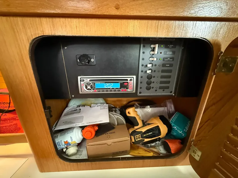 Slide: The Image of Electrical panel and storage in a 2000 Catalina 36 MkII sailboat cabin. - 43