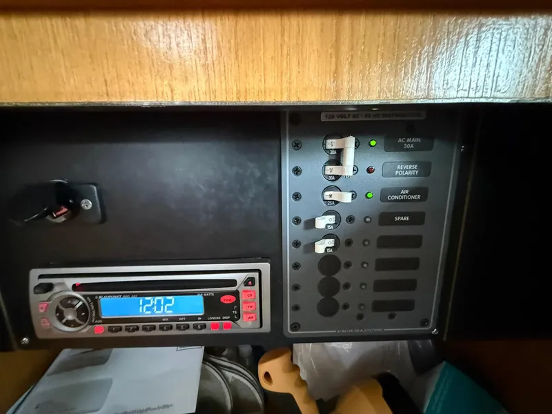 Slide: The Image of Control panel and stereo system inside a 2000 Catalina 36 MkII sailboat. - 44