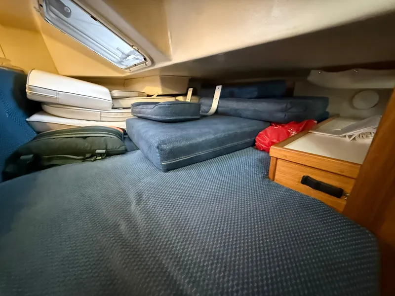 Slide: The Image of Interior cabin of a 2000 Catalina 36 MkII sailboat with cushions and storage. - 48