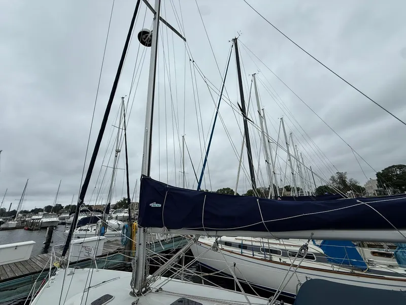 Slide: The Image of Catalina 36 MkII sailboat from 2000 docked at a marina under cloudy skies. - 5