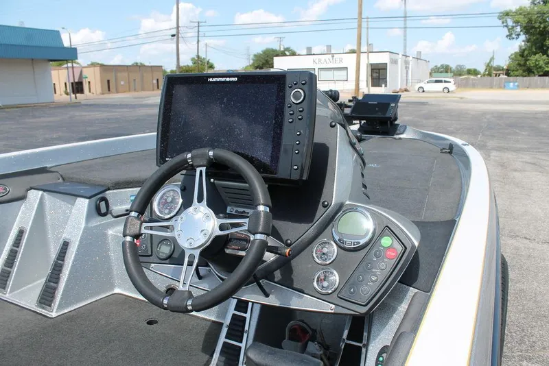 Slide: The Image of 2017 Ranger Z520C boat dashboard with steering wheel and electronic display. - 4