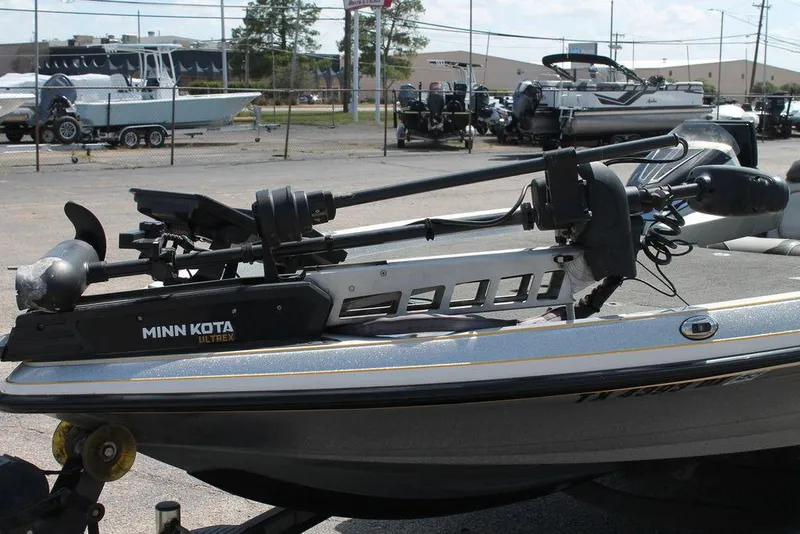 Slide: The Image of 2017 Ranger Z520C boat with Minn Kota Ultrex trolling motor in a marina setting. - 6