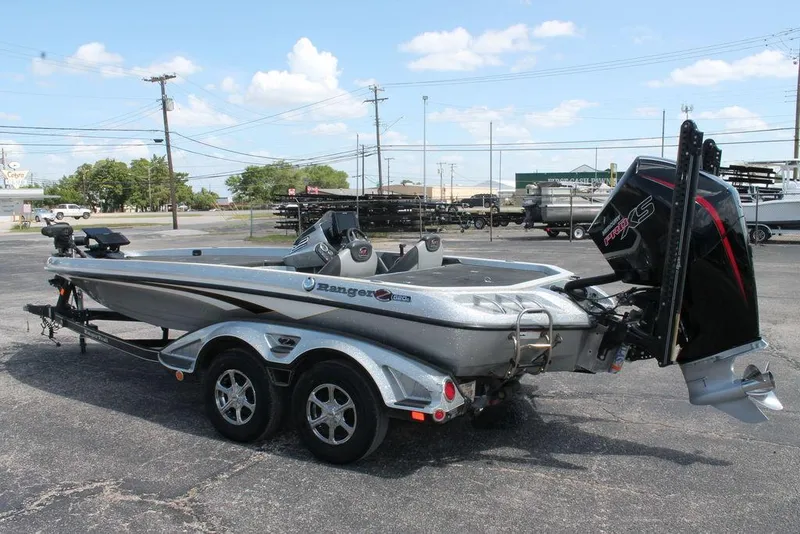 Slide: The Image of 2017 Ranger Z520C bass boat with trailer, parked outdoors under a clear sky. - 8