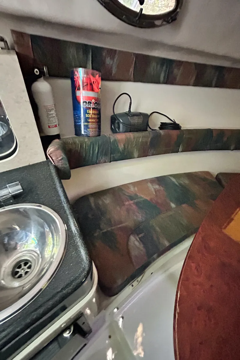 Slide: The Image of Interior of 1995 Donzi 255 Medallion boat with sink and seating area. - 11