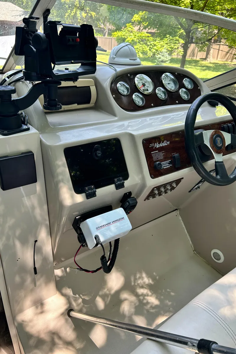 Slide: The Image of 1995 Donzi 255 Medallion boat dashboard with steering wheel and instrument panel. - 3
