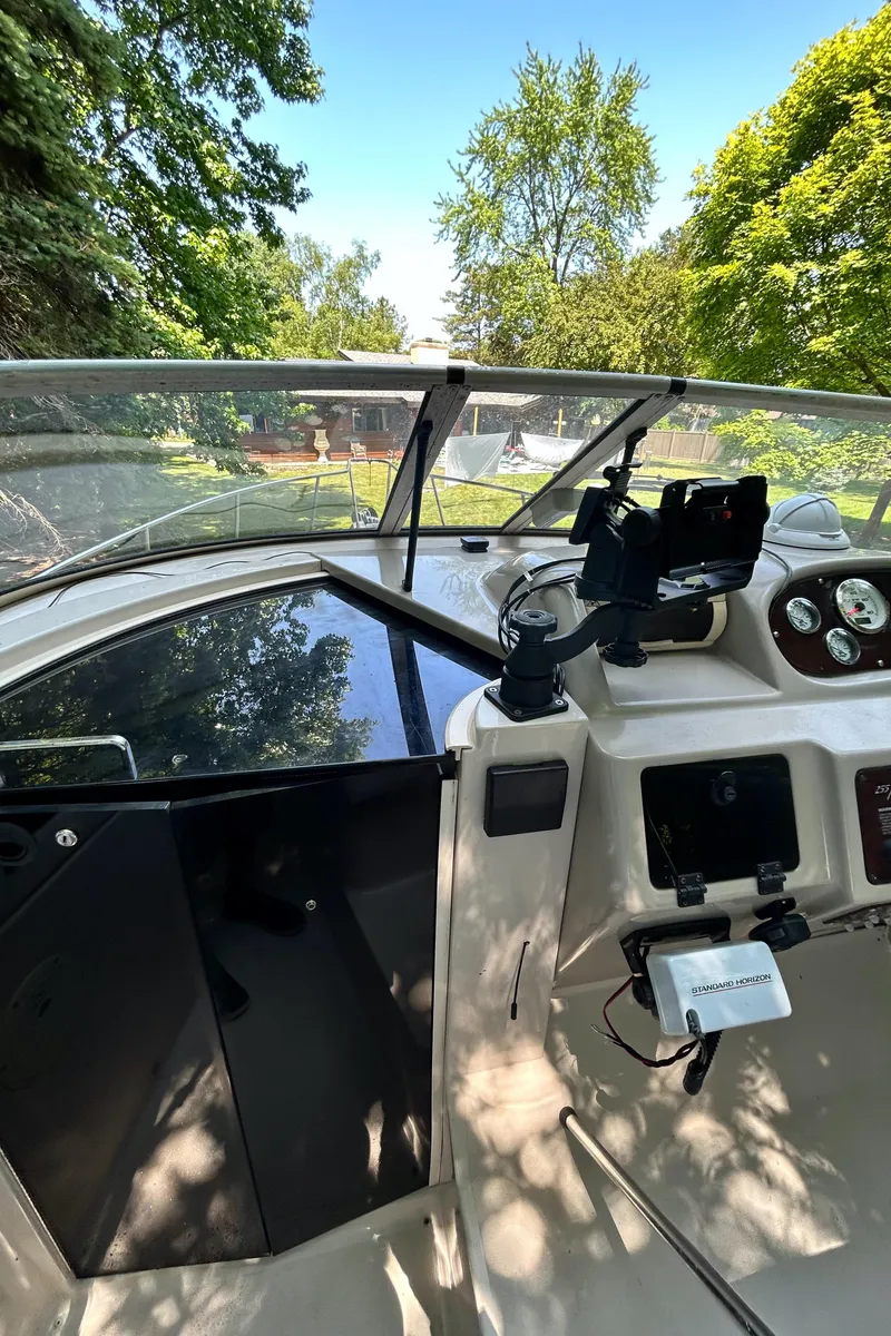 Slide: The Image of 1995 Donzi 255 Medallion boat cockpit with steering wheel and dashboard. - 6