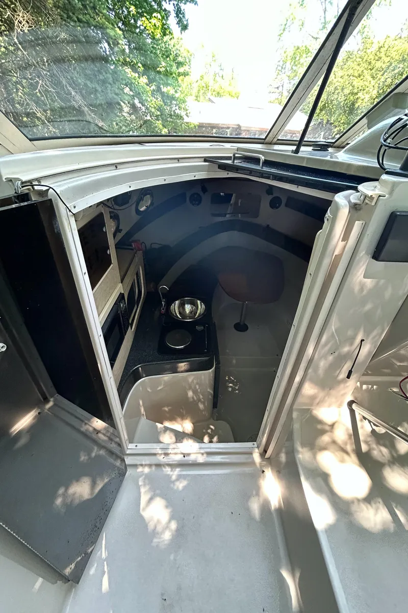 Slide: The Image of Interior view of 1995 Donzi 255 Medallion boat cabin with kitchenette. - 8