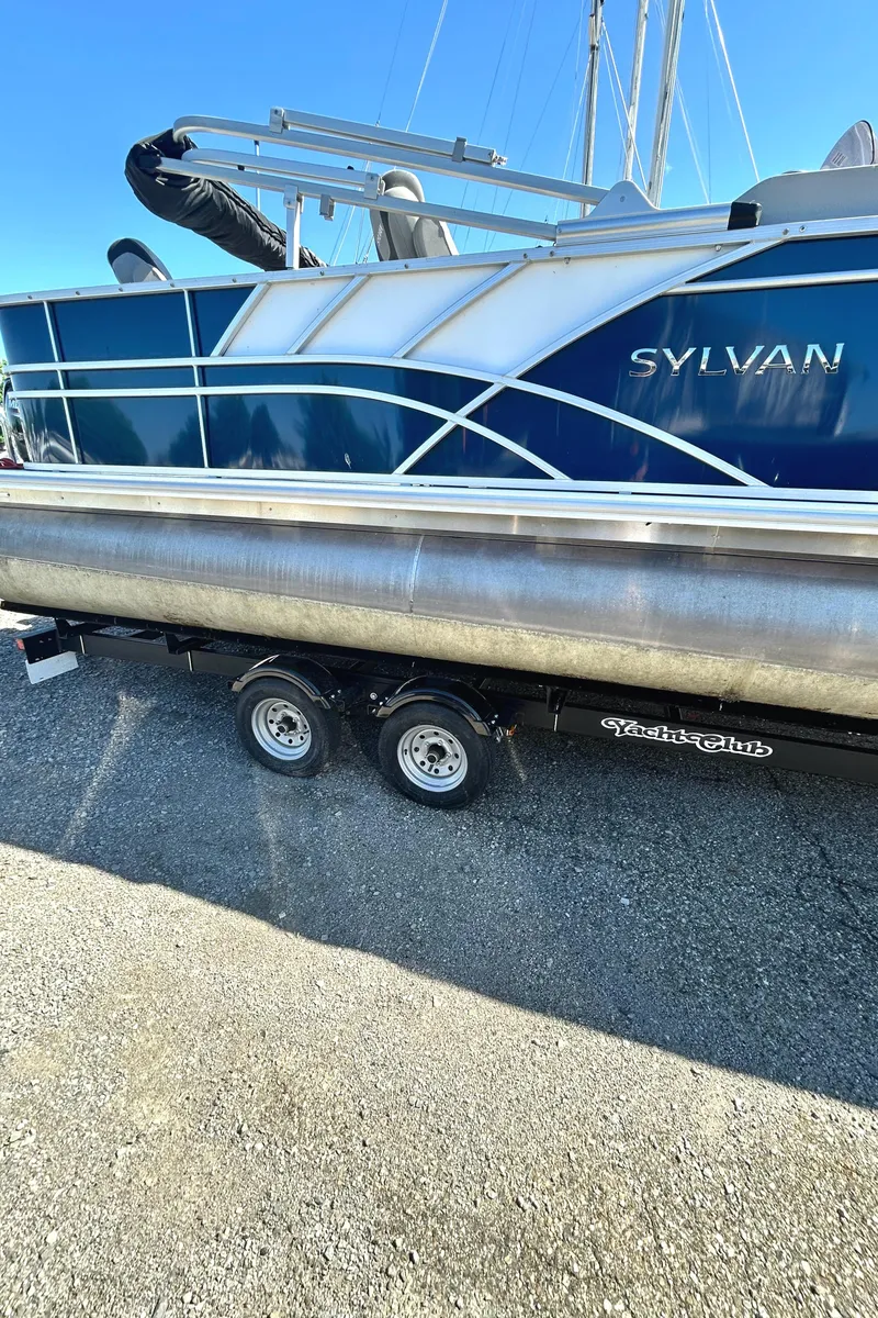 Slide: The Image of 2022 Sylvan L3 Party Fish pontoon boat on trailer. - 11