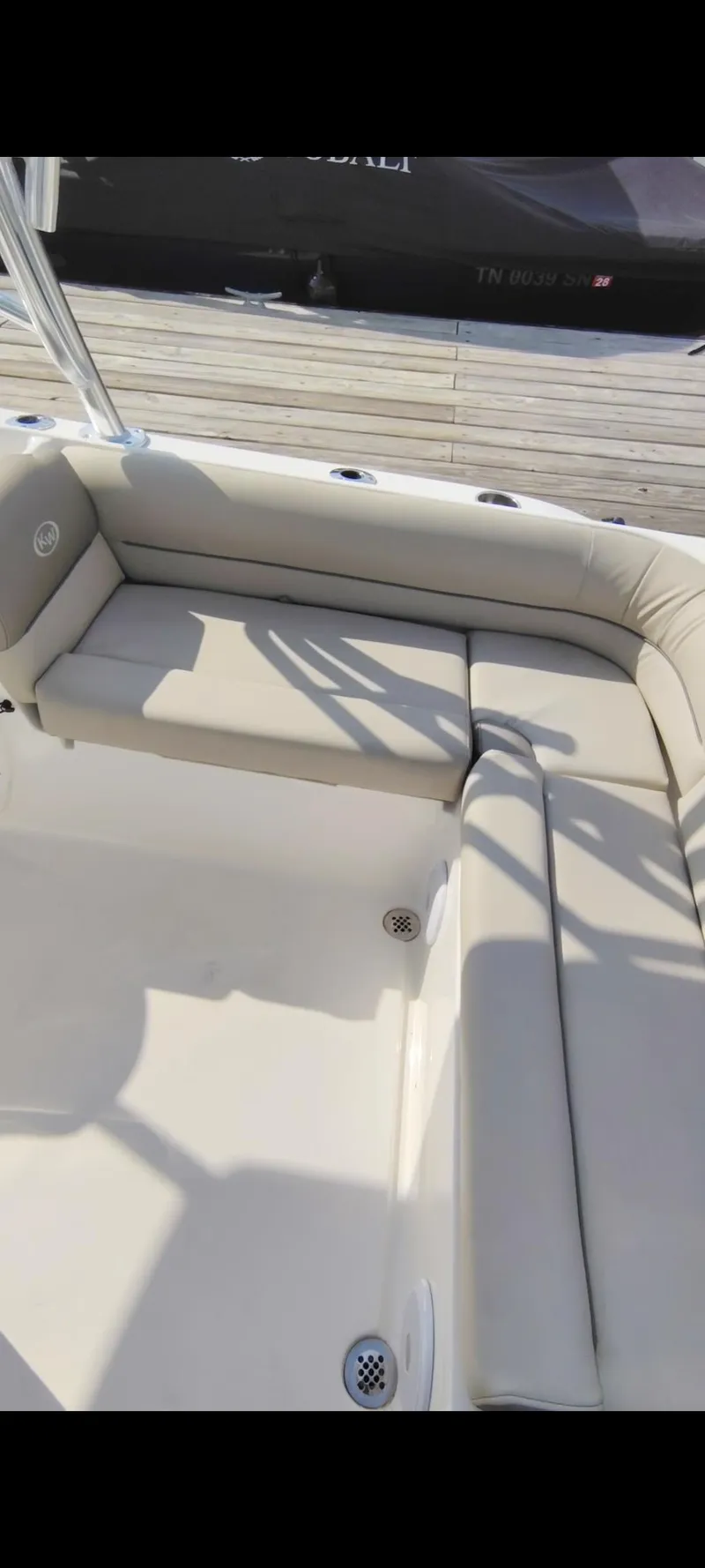 Slide: The Image of 2023 Key West 239 DFS boat interior with beige seating and deck. - 15