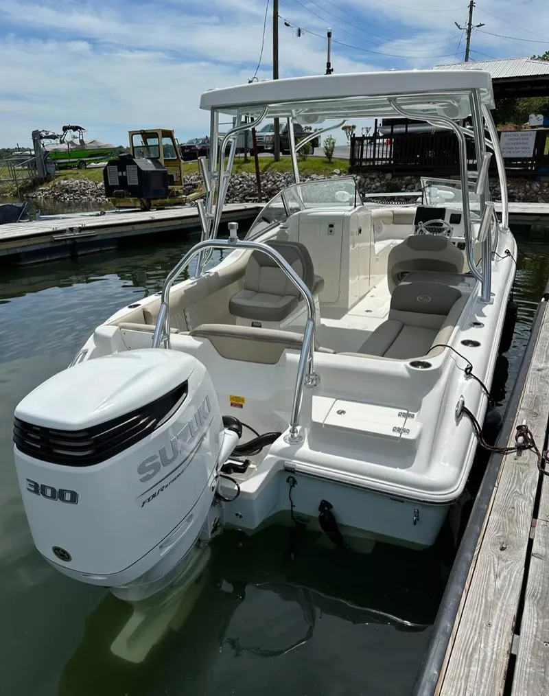 Slide: The Image of 2023 Key West 239 DFS boat with Suzuki 300 engine docked in marina. - 2