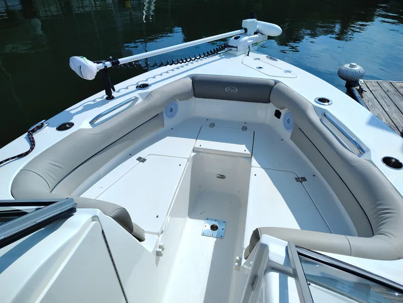 Slide: The Image of 2023 Key West 239 DFS boat interior with seating and storage compartments. - 22