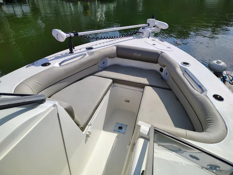 Slide: The Image of 2023 Key West 239 DFS boat interior with cushioned seating and trolling motor. - 26