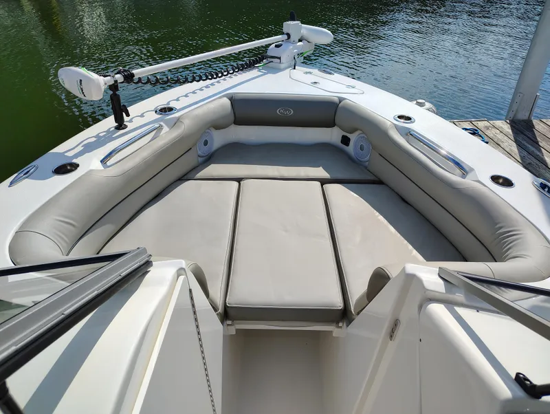 Slide: The Image of 2023 Key West 239 DFS boat interior with cushioned seating and water view. - 27