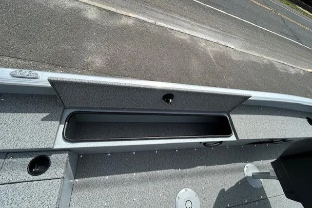 Slide: The Image of 2025 Lund 1875 Alaskan SS boat interior with storage compartment, gray textured finish. - 10