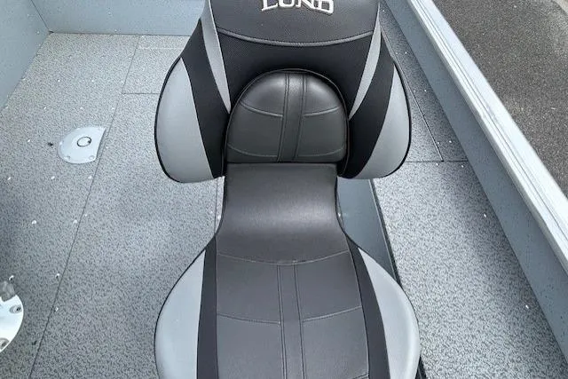 Slide: The Image of 2025 Lund 1875 Alaskan SS boat seat, black and gray design, interior view. - 13