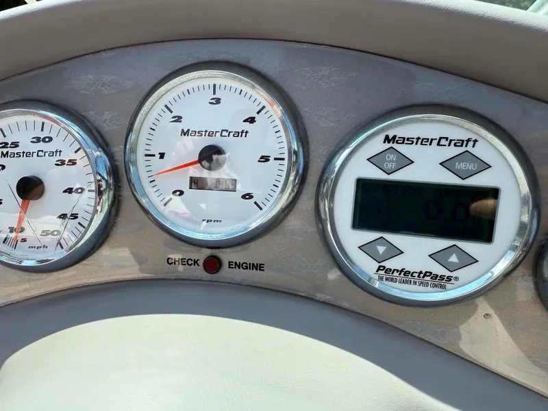 Slide: The Image of Dashboard of a 2001 MasterCraft X-Star boat with speedometer and PerfectPass system. - 14