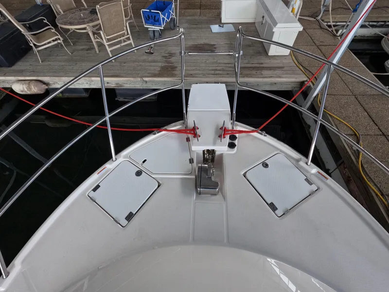 Slide: The Image of Bow view of 2020 Cutwater C-30 Sedan boat docked at marina. - 16