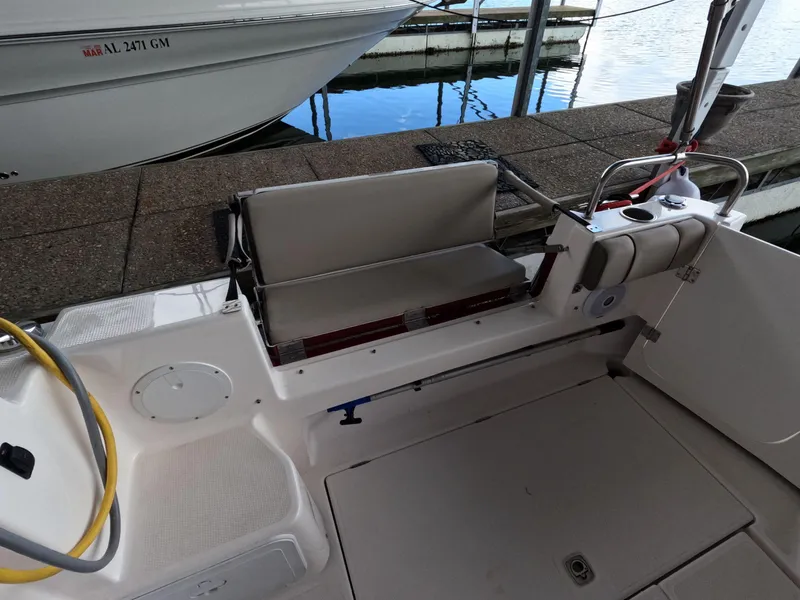 Slide: The Image of 2020 Cutwater C-30 Sedan boat interior with seating and dock view. - 26