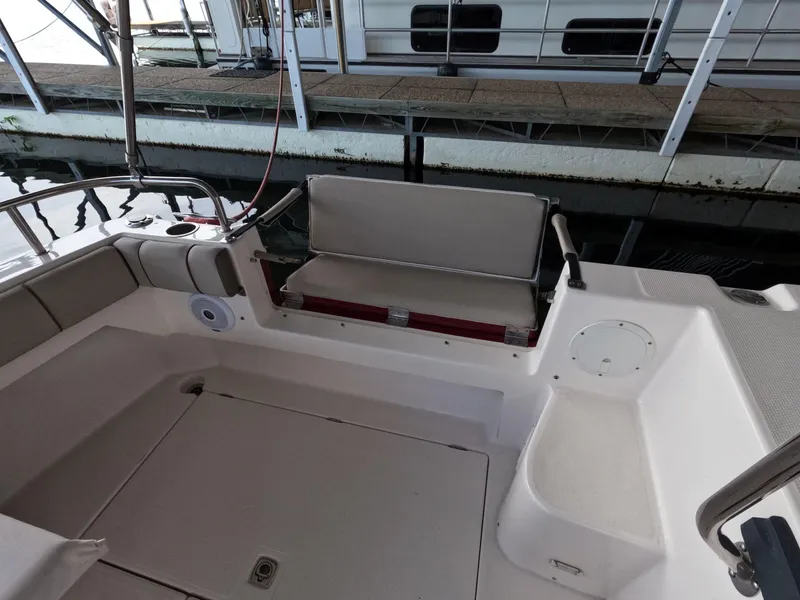 Slide: The Image of 2020 Cutwater C-30 Sedan boat interior with seating and dock view. - 27