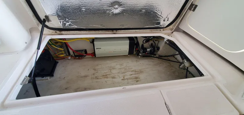 Slide: The Image of 2020 Cutwater C-30 Sedan engine compartment with wiring and equipment. - 32