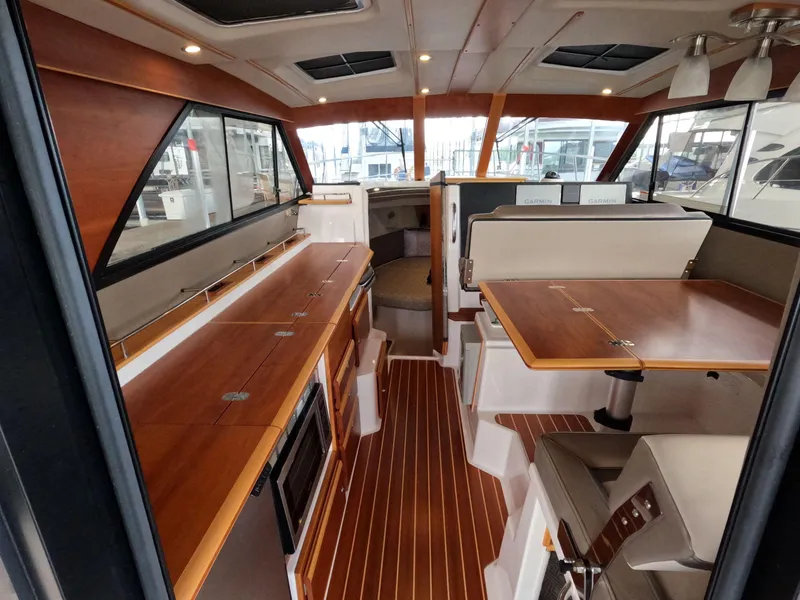 Slide: The Image of Interior of 2020 Cutwater C-30 Sedan boat with wood finish and modern amenities. - 35