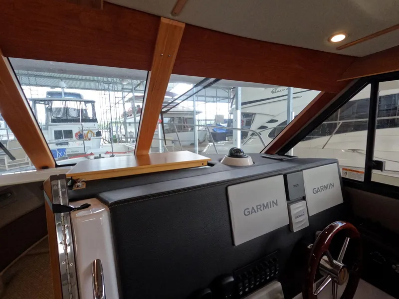 Slide: The Image of Interior view of 2020 Cutwater C-30 Sedan boat with Garmin navigation system. - 38