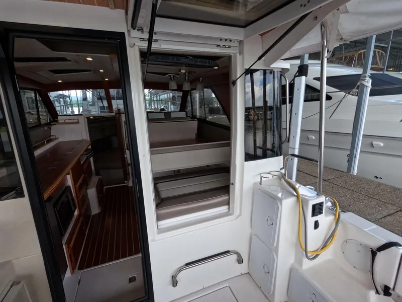 Slide: The Image of Interior view of 2020 Cutwater C-30 Sedan boat, showcasing seating and cabin area. - 42