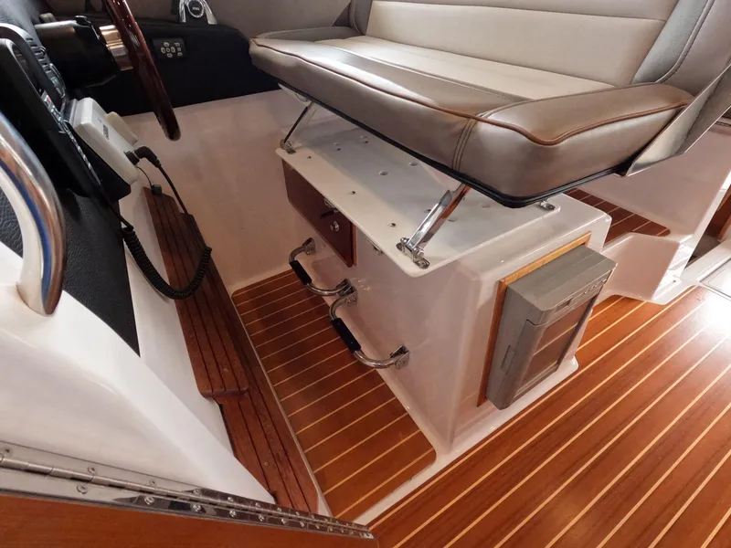 Slide: The Image of 2020 Cutwater C-30 Sedan interior with wood flooring and cushioned seating. - 44