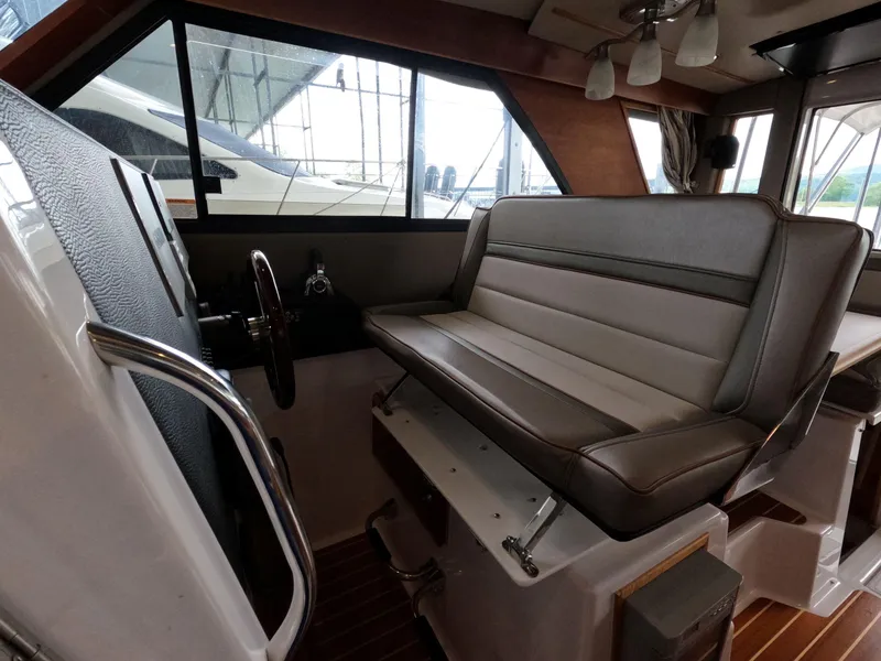 Slide: The Image of Interior of 2020 Cutwater C-30 Sedan boat with steering wheel and seating area. - 45