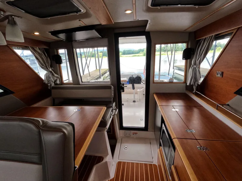 Slide: The Image of Interior of 2020 Cutwater C-30 Sedan boat with wood finish and spacious layout. - 46
