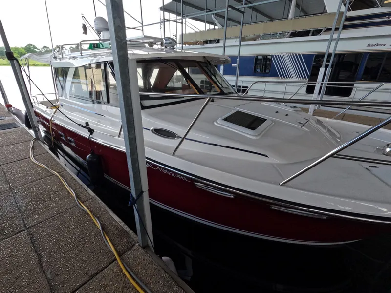 Slide: The Image of 2020 Cutwater C-30 Sedan docked at marina, showcasing sleek design and modern features. - 9