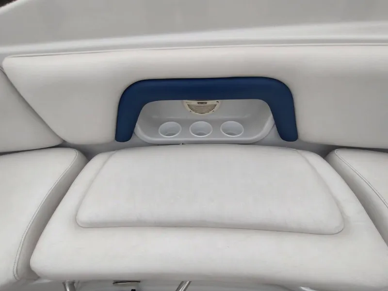 Slide: The Image of Crownline 270 BR 2005 boat interior with white seating and cup holders. - 10