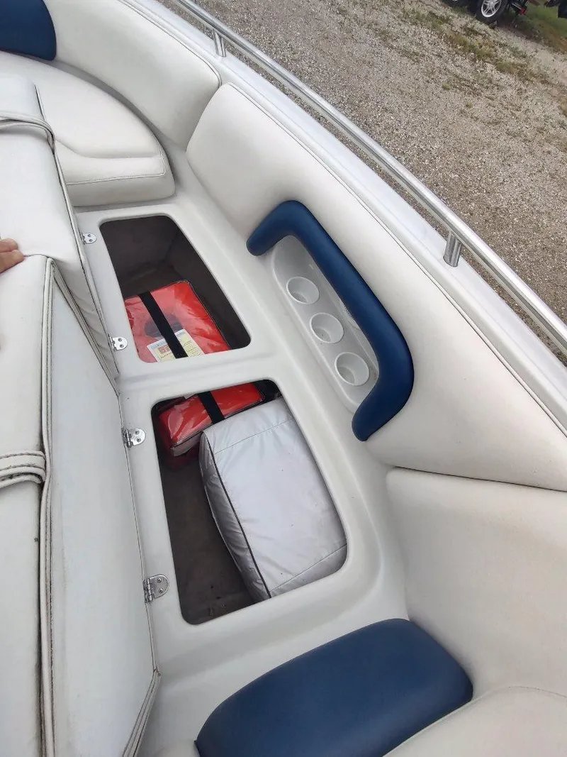 Slide: The Image of 2005 Crownline 270 BR boat interior with storage compartments and life jackets. - 16