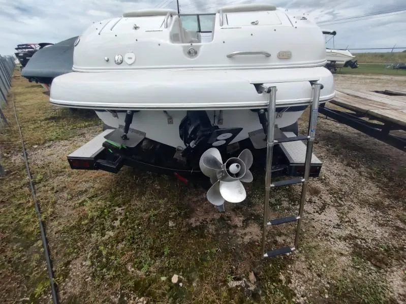 Slide: The Image of 2005 Crownline 270 BR boat rear view with propeller and ladder. - 21