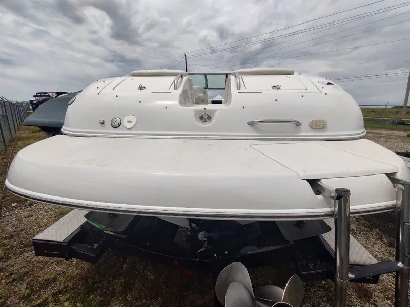 Slide: The Image of 2005 Crownline 270 BR boat, rear view, on trailer under cloudy sky. - 24