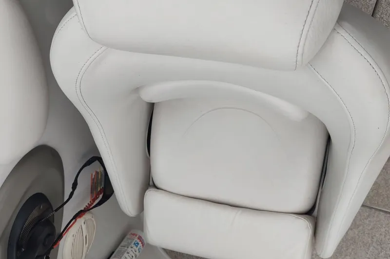 Slide: The Image of White leather seat on a 2005 Crownline 270 BR boat. - 34