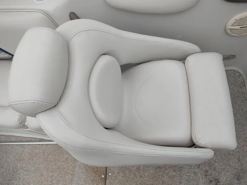 Slide: The Image of 2005 Crownline 270 BR boat seat, white leather upholstery, top view. - 4