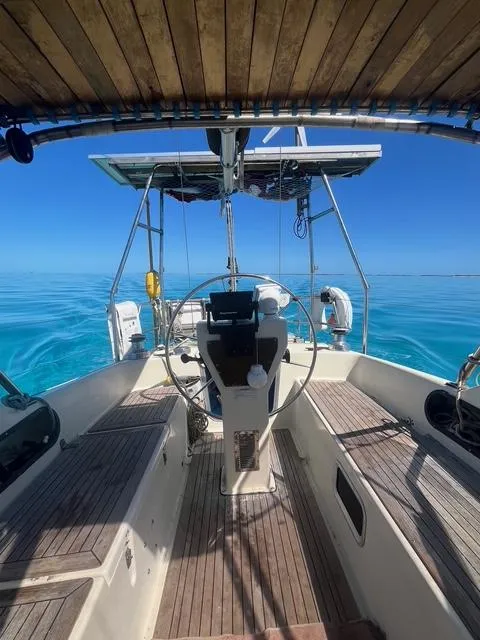 Slide: The Image of Sailboat cockpit view, Maxi 35 CC, 1990 model, on calm blue ocean waters. - 11