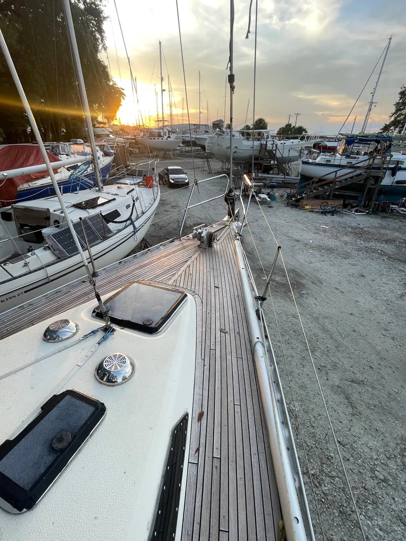 Slide: The Image of Sailboat deck view at sunset, Maxi 35 CC, 1990 model, in a marina. - 14