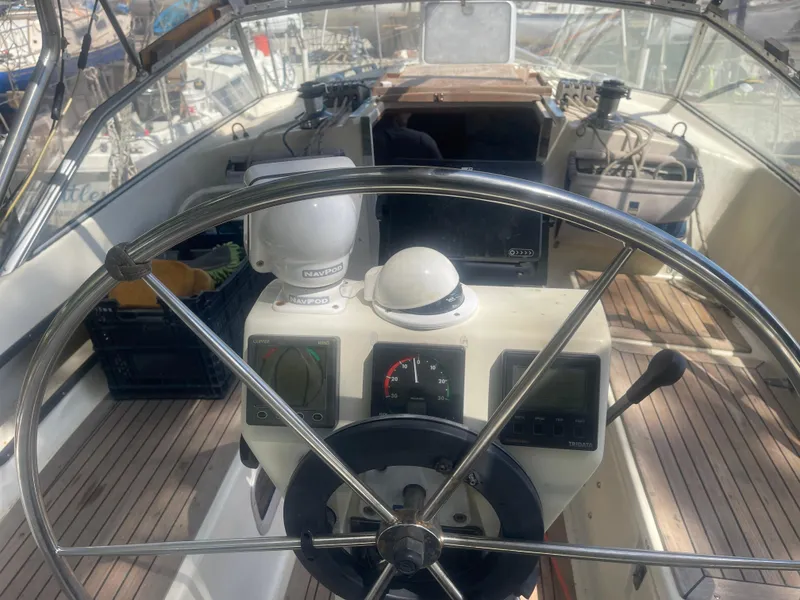 Slide: The Image of Steering wheel and navigation instruments on a 1990 Maxi 35 CC sailboat. - 19