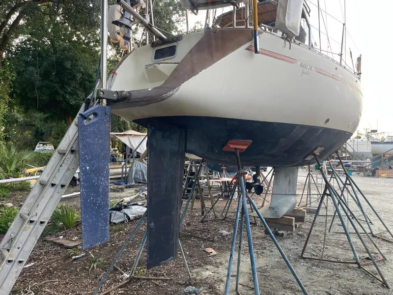 Slide: The Image of Sailboat Maxi 35 CC 1990 on stands in a boatyard, undergoing maintenance. - 20